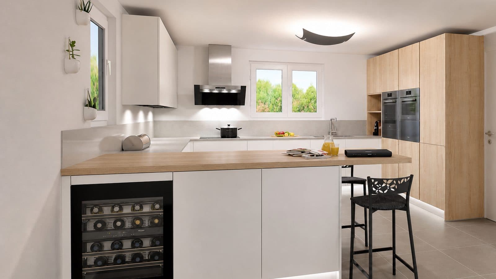 The same kitchen after renovation: handleless white fronts, wood worktop, light oak tall units and a built-in oven.