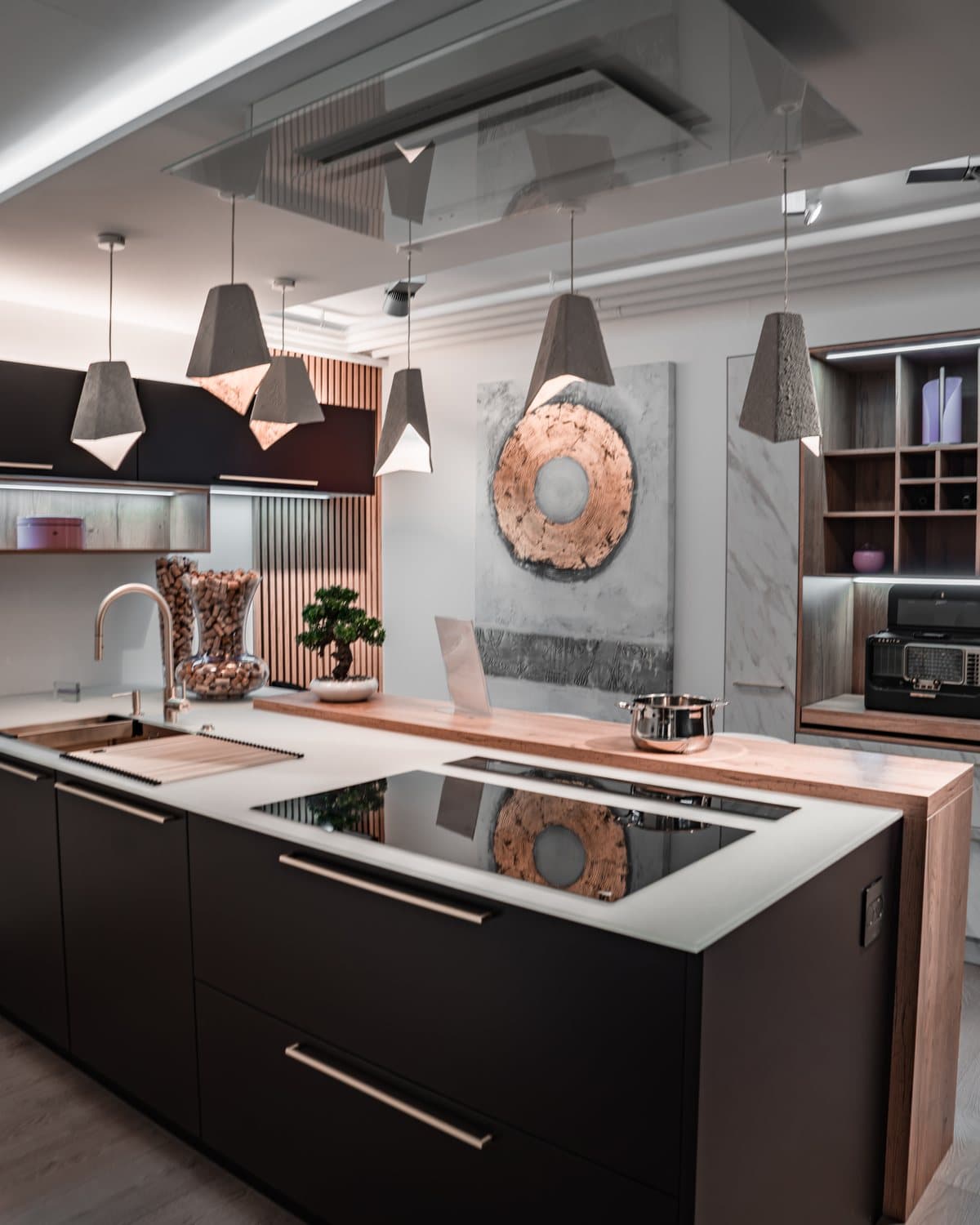 Matt black island and pale worktop in the Teutschmann showroom in Nyon