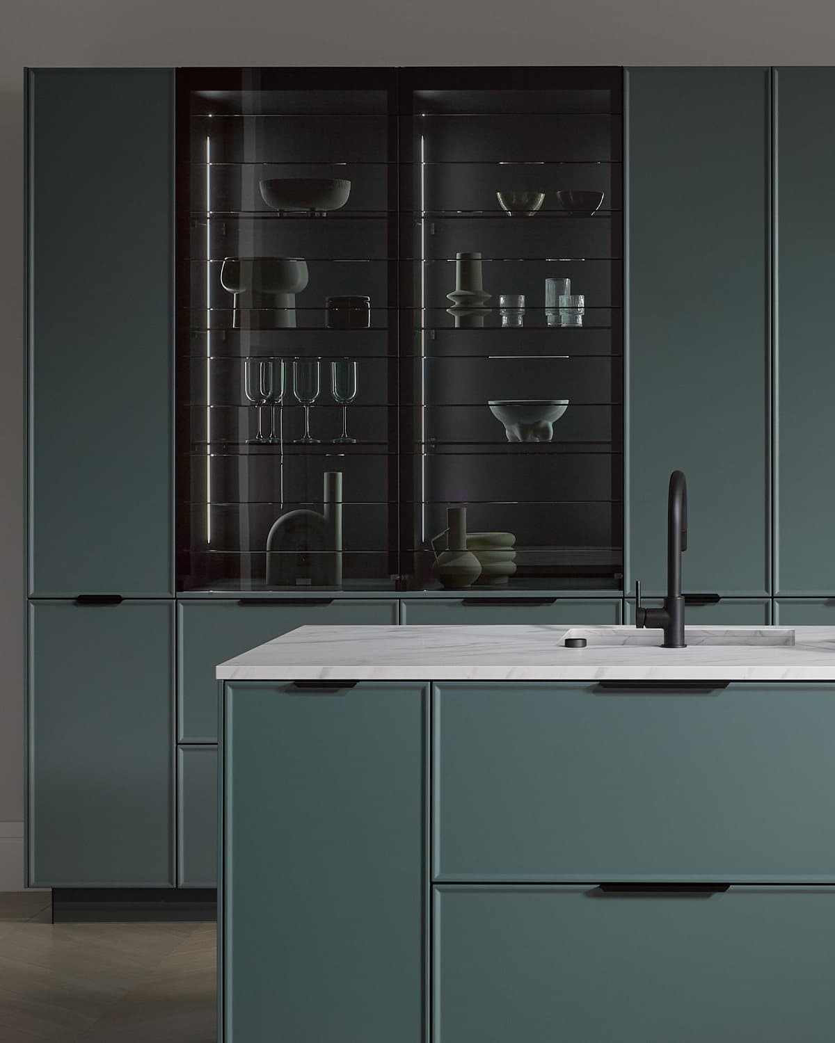 Glazed tall units and grey-green fronts, a bespoke kitchen layout