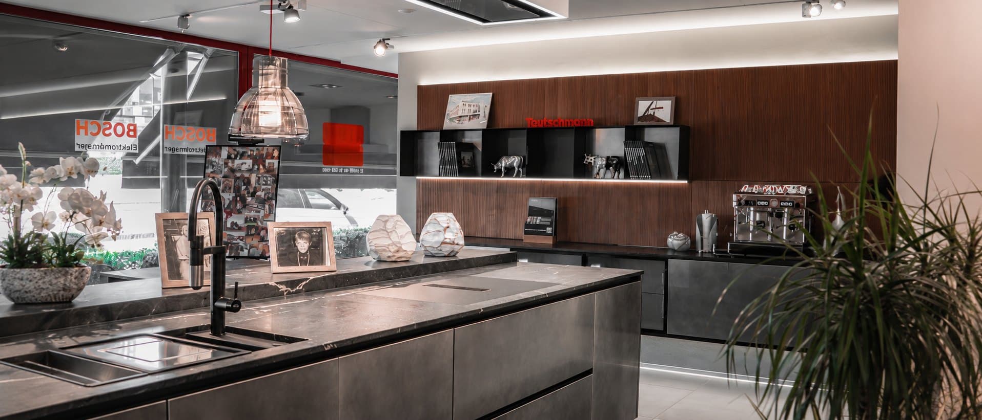An overall view of the Teutschmann showroom in Nyon, kitchens displayed over two floors