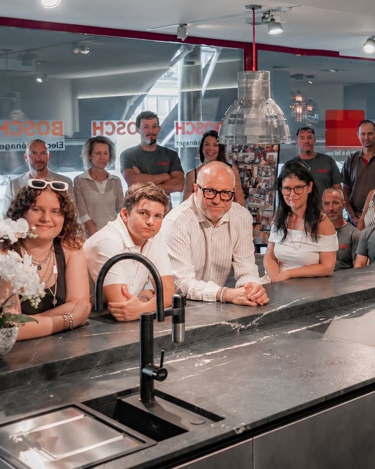 The Teutschmann team and family together in the showroom in Nyon