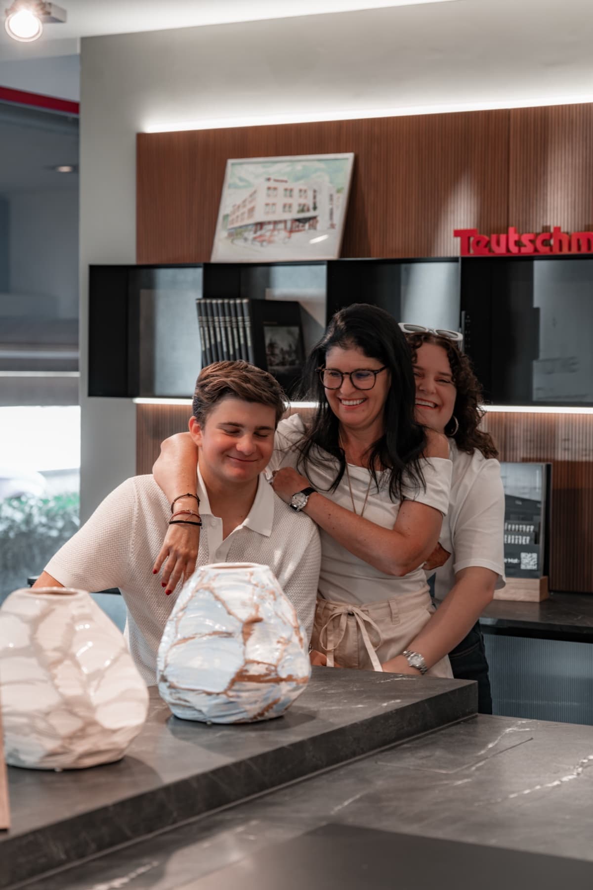 Sandrine Teutschmann and her family in the showroom in Nyon